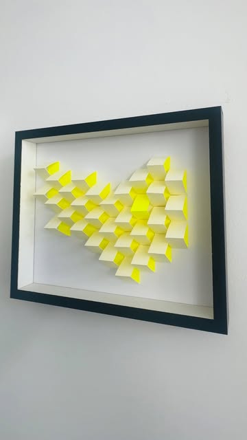 Yellow Heart: white and neon yellow paper cubes forming a heart in a shadow box