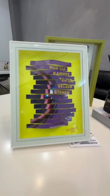Nur Du Kannst: typographic paper-craft piece in purple and neon yellow